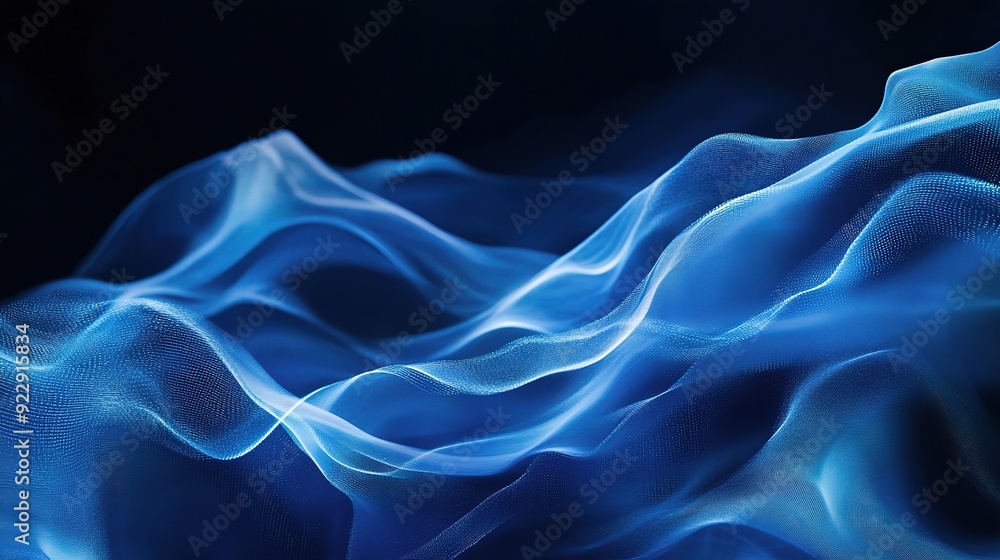 Obraz premium Azure Flow: Abstract waves of blue energy cascade across a dark backdrop, evoking a sense of movement, power, and ethereal beauty. 