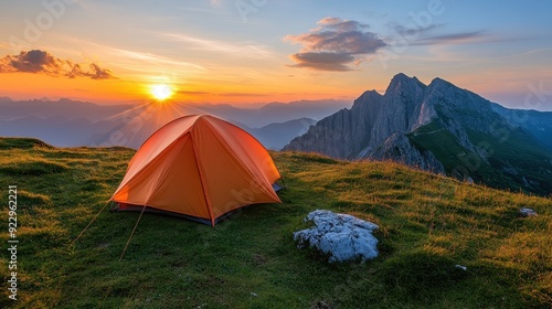  Scenic view of orange tent against mountain