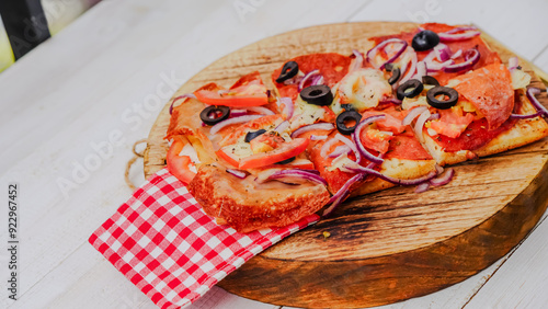 Slice of pepperoni pizza in hand isolated on white. Top view on paperoni pizza. Concept for italian food, street food, fast food, quick bite photo