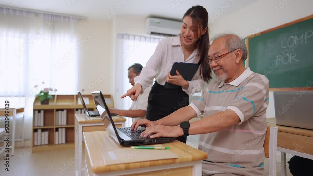 Asian female instructor teaching mature students in classroom at school. Asian female instructor teaching mature students in classroom at school.