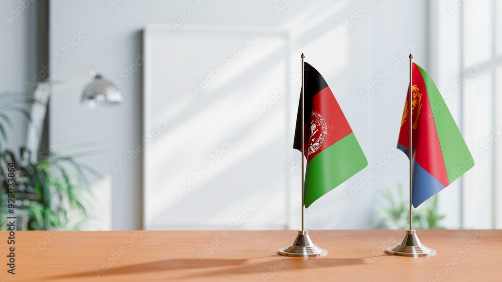 FLAGS OF AFGHANISTAN AND ERITREA ON TABLE FLAGS OF AFGHANISTAN AND ERITREA ON TABLE