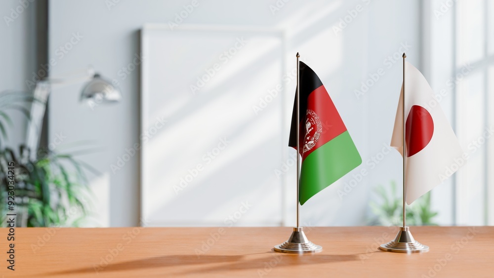 FLAGS OF AFGHANISTAN AND JAPAN ON TABLE FLAGS OF AFGHANISTAN AND JAPAN ON TABLE
