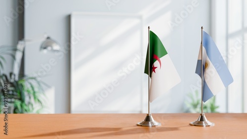 FLAGS OF ALGERIA AND ARGENTINA ON TABLE photo