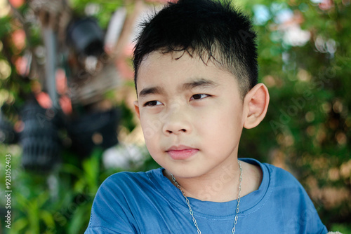 A boy with a stressed expression on his face. photo