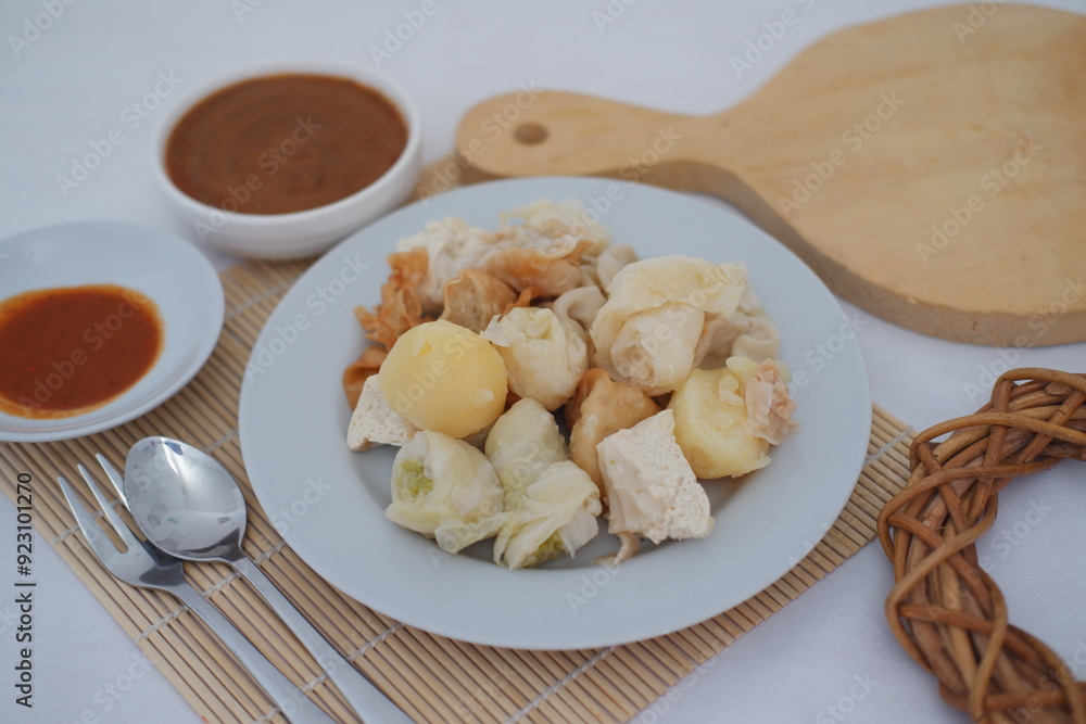 Siomay, Indonesian traditional street food with spicy peanut sauce Siomay, Indonesian traditional street food with spicy peanut sauce