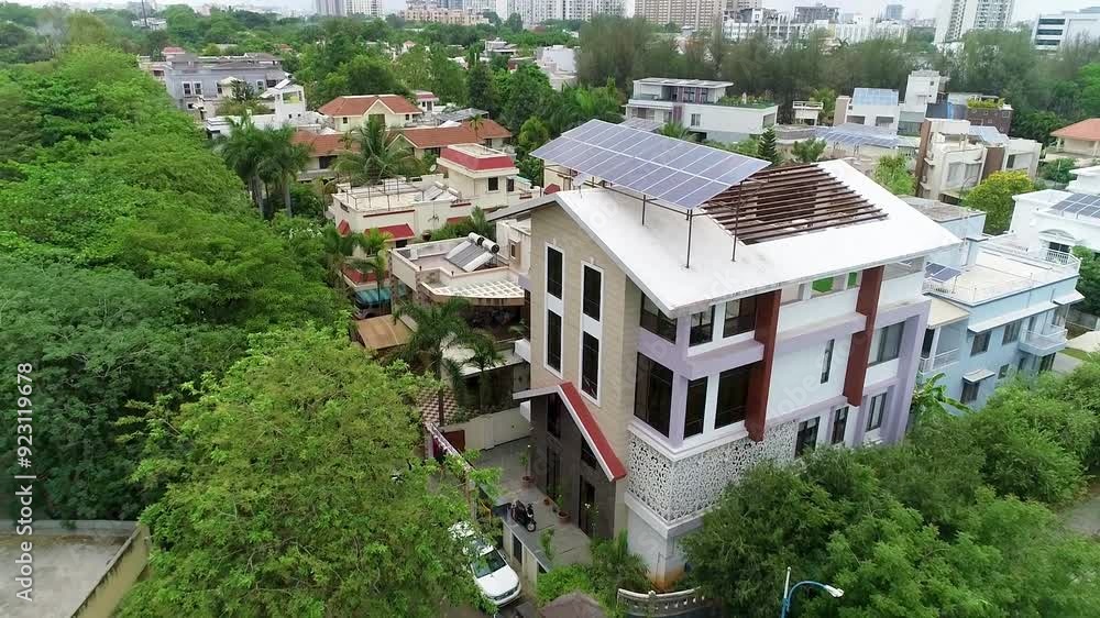 Drone shot of Houses which is in India , one house have solar panels Drone shot of Houses which is in India , one house have solar panels