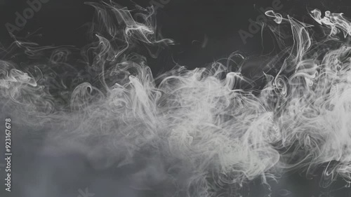 White smoke slowly moving on a black background
