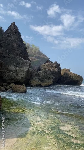 Pristine and natural Salt rock tidal pool in wohkudu beach yogyakarta photo