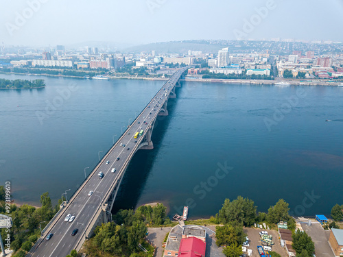 Russia, Krasnoyarsk - July 23, 2018: General Aerial View of the city center, Communal Bridge over the Yenisei River, Aerial photography photo