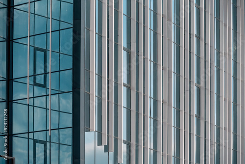 Wallpaper Mural empty glass windows of a modern building with a reflection of the sky in the glass Torontodigital.ca