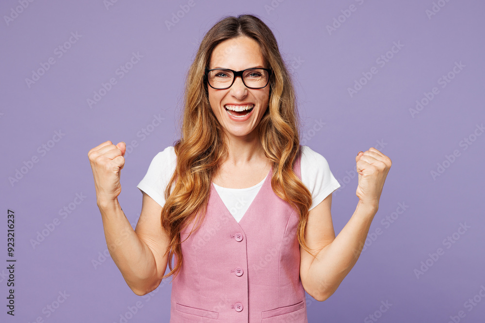 Young excited employee business woman corporate lawyer wear white t-shirt vest glasses doing winner gesture celebrate clenching fists say yes isolated on plain pastel light purple background studio.