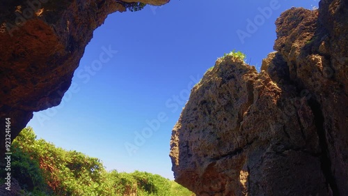 bottom to top front to back view inside of rocky coral green valley look out to blue clear sky at good weather sunshine day time in Longpan Park photo