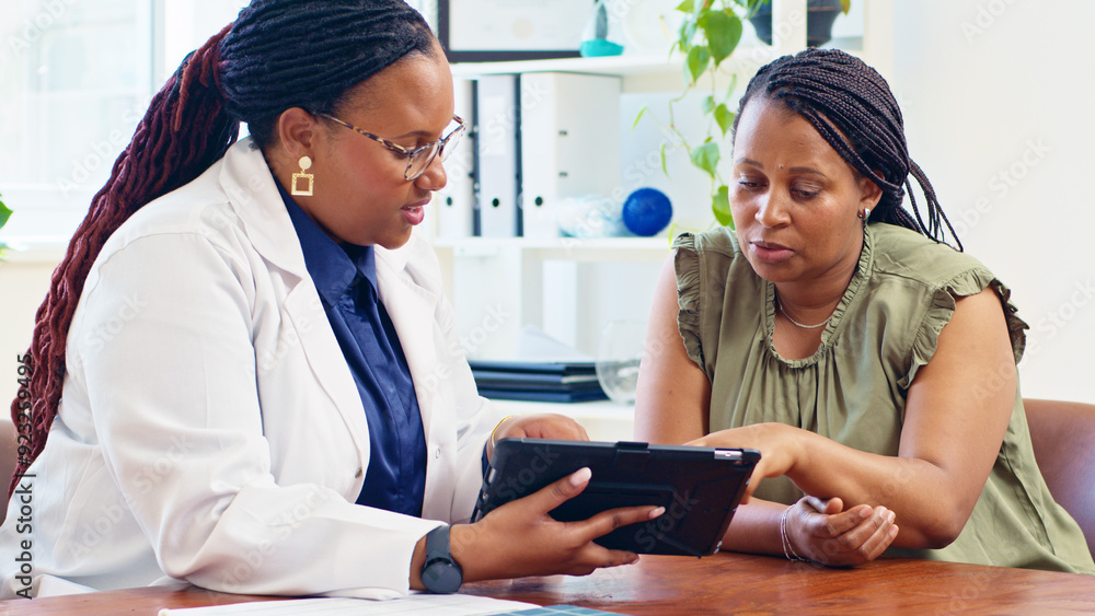 Doctor Consults with Patient Using Digital Tablet in Modern Medical Office Setting Doctor Consults with Patient Using Digital Tablet in Modern Medical Office Setting