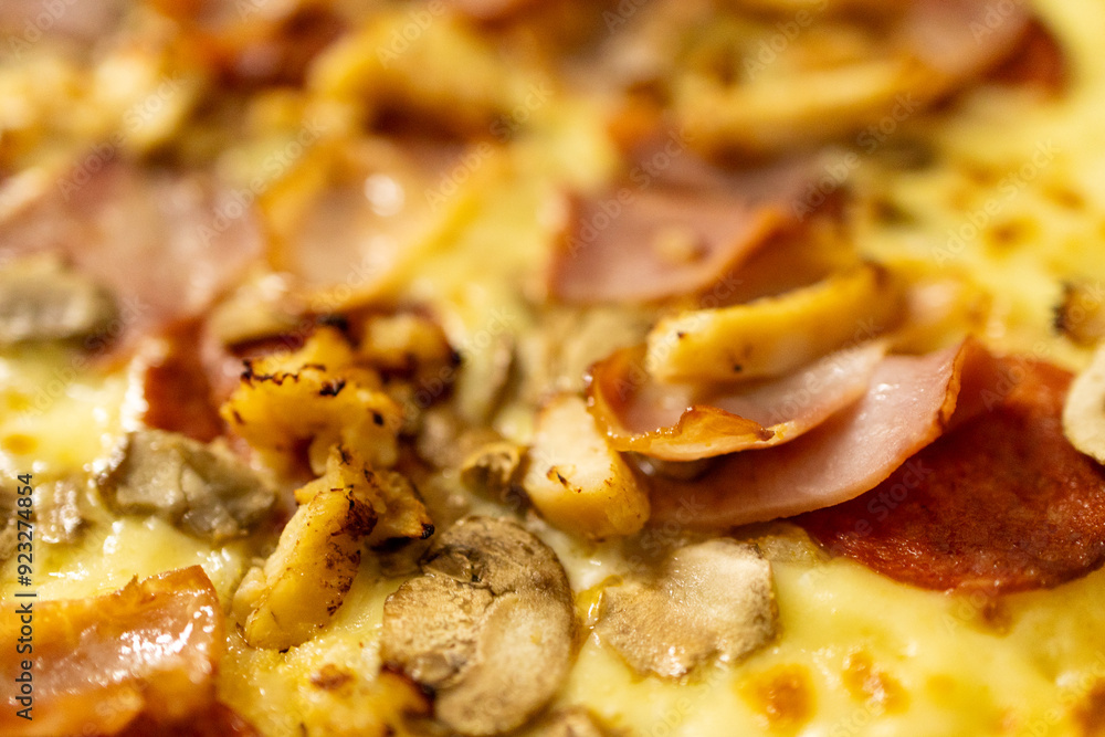Close-up of pizza with chives, salami, chicken breast, mushrooms and cheese. Close-up of pizza with chives, salami, chicken breast, mushrooms and cheese.