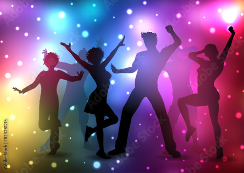 Silhouettes of people dancing on a disco lights background