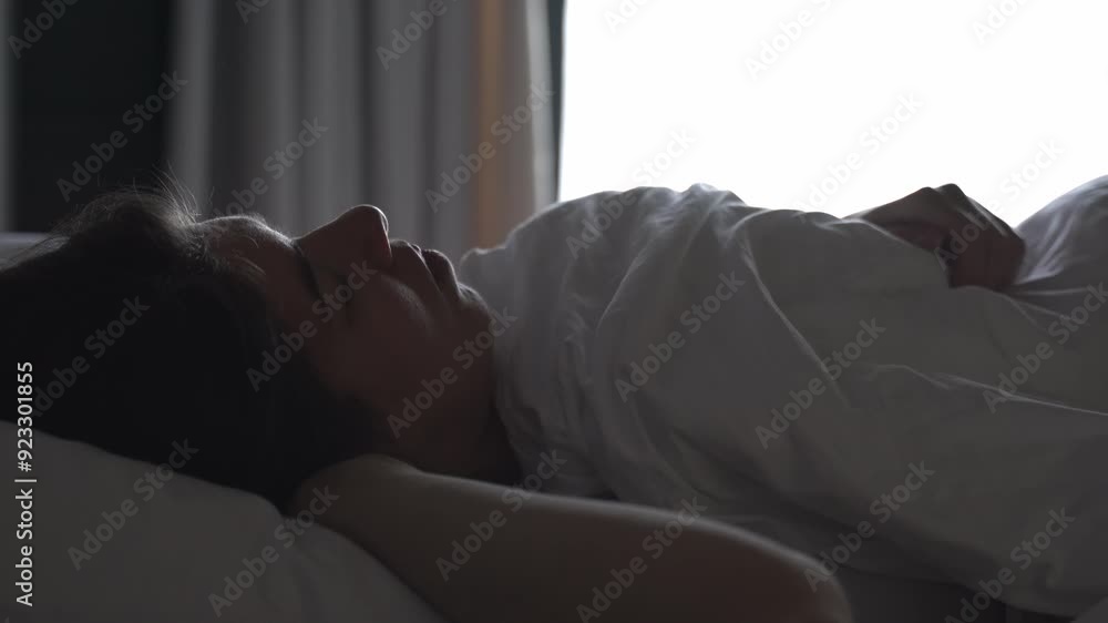 Woman Sleeping in Bed with Morning Light Woman Sleeping in Bed with Morning Light