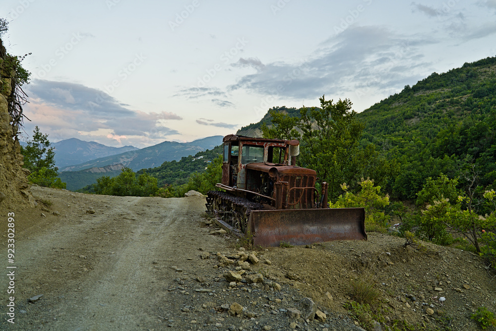 Naklejka premium Rusty excavator in the national park Hotova Dangell