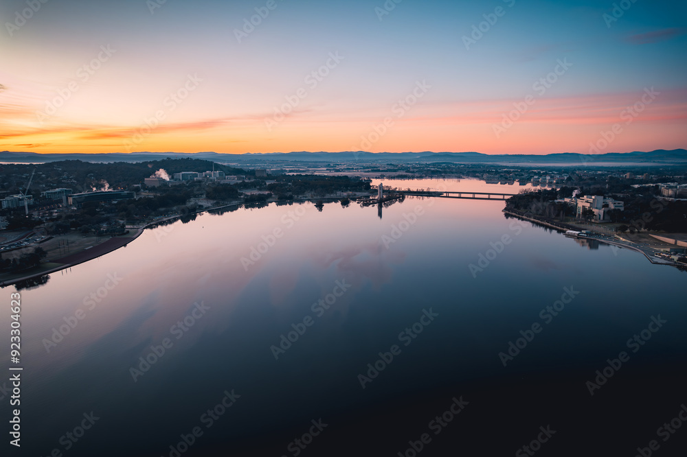 High angle view of river by buildings against sky during sunset High angle view of river by buildings against sky during sunset