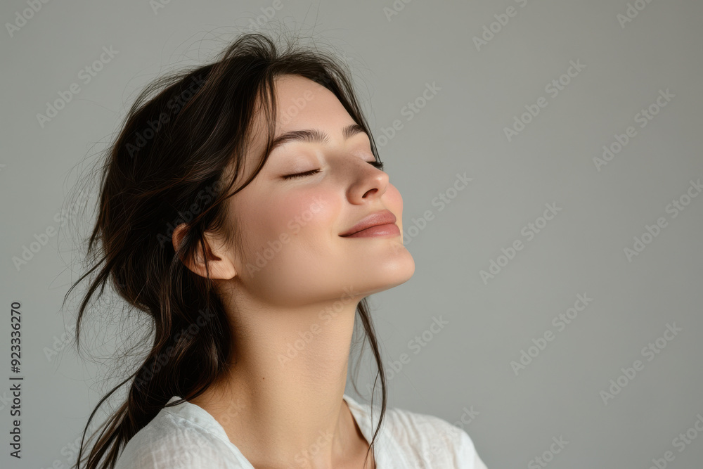 A close up of a woman's face with her eyes closed A close up of a woman's face with her eyes closed