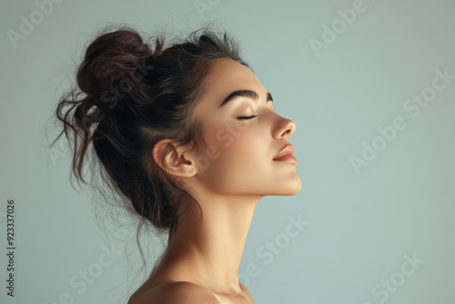 A close up of a woman's face with her eyes closed