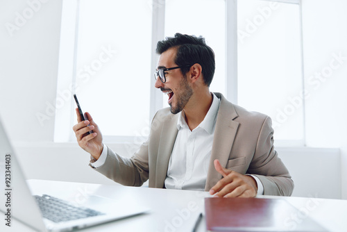 Man businessman winner talk computer smile office phone