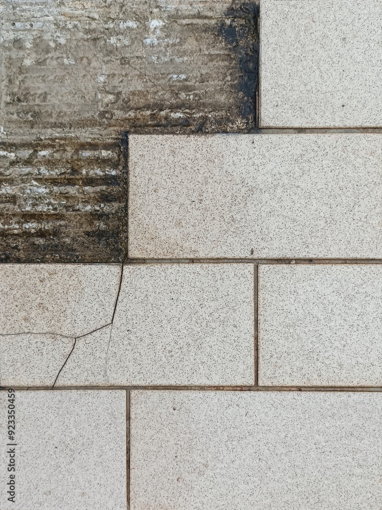 Naklejka premium white brick wall and Broken tile walkway waiting for repair