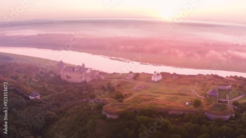 Khotyn Fortress (Ukrainian: Хотинська фортеця; Romanian: Cetatea Hotinului)  fortress of the 10th-18th centuries, huge walls towers on the banks  Dniester,  drone flies by at dawn aerial photography photo