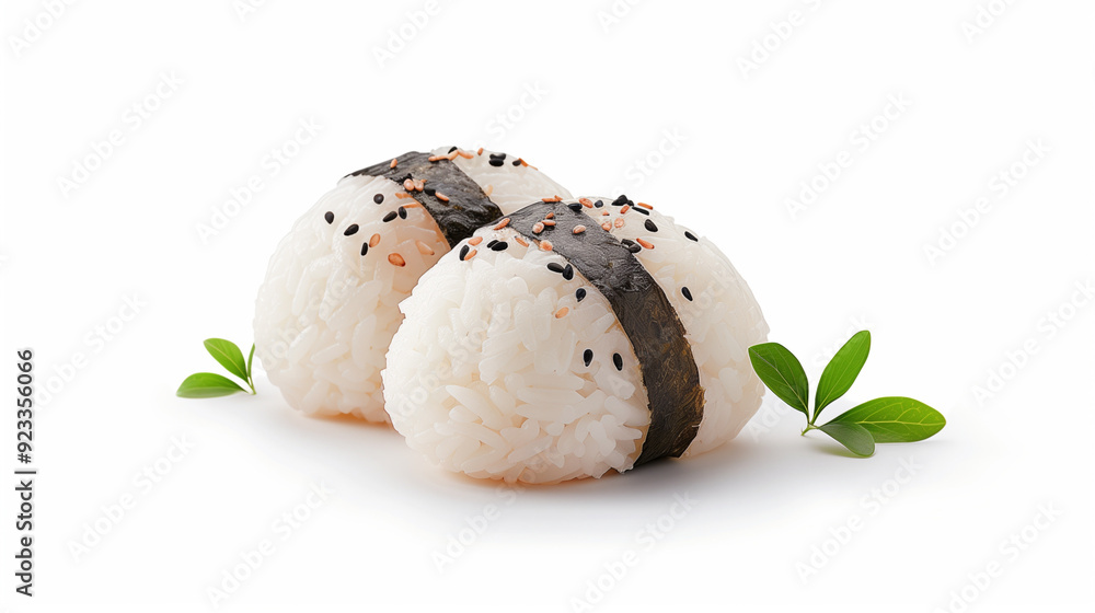 Two Japanese onigiri rice balls wrapped in seaweed, featuring sesame seeds, showcasing traditional Japanese cuisine. Two Japanese onigiri rice balls wrapped in seaweed, featuring sesame seeds, showcasing traditional Japanese cuisine.