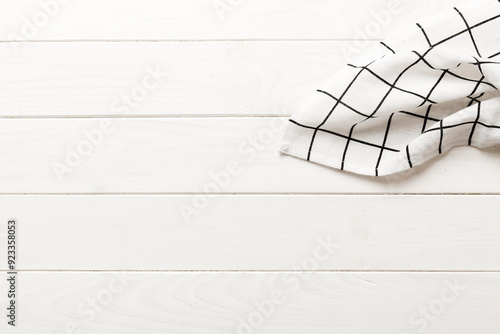 top view with white empty kitchen napkin isolated on table background. Folded cloth for mockup with copy space, Flat lay. Minimal style