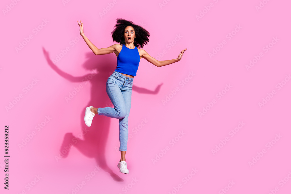 Photo of amazed girl jumping feel impressed isolated pastel pink color background Photo of amazed girl jumping feel impressed isolated pastel pink color background