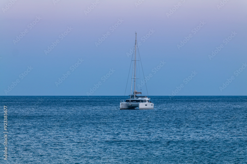 greece sounion temple with boats in the sea at sunset greece sounion temple with boats in the sea at sunset