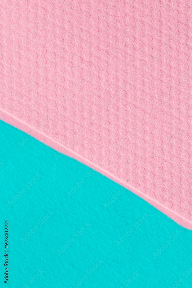 close up of pink and turquoise sheets of cardboard close up of pink and turquoise sheets of cardboard