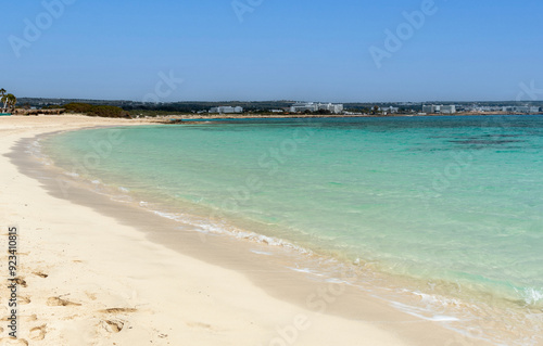 Empty sandy tropical beach. Golden sand, clear sky