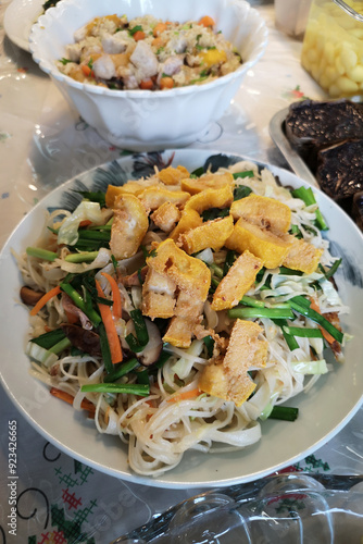 Rice vermicelli with mushrooms on a plate, a dish for Chinese New Year