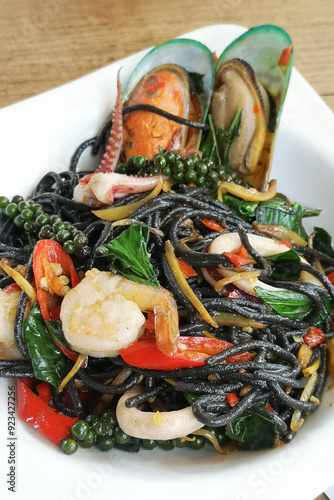 Black spaghetti stir-fried with drunken seafood a delicious and healthy meal