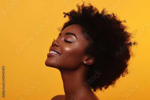 A close up of a black woman's face with her eyes closed