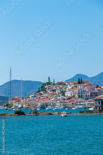 Greece Peloponnese region Poros island and Galatas town seaside sailing boats on the blue sea photo