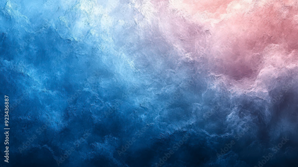 Fototapeta premium Abstract blue and pink smoke clouds blending together in a soft textured background.