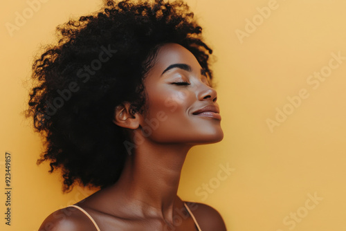 A close up of a black woman's face with her eyes closed