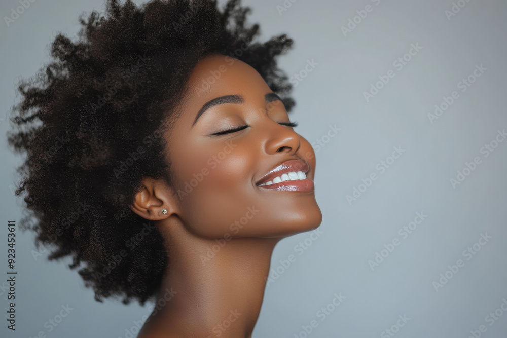 A close up of a black woman's face with her eyes closed A close up of a black woman's face with her eyes closed