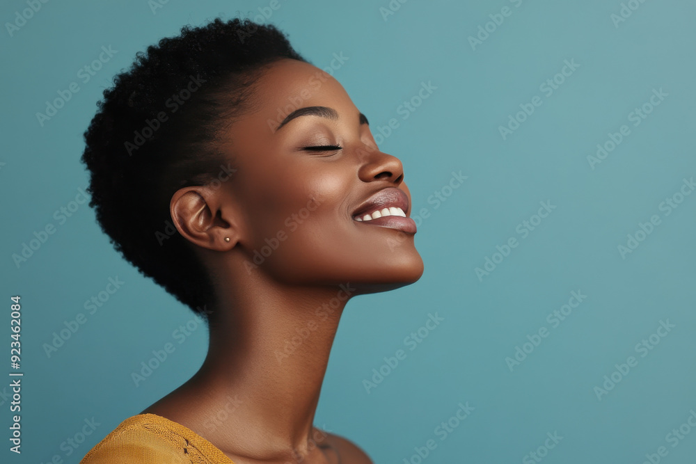 A close up of a black woman's face with her eyes closed A close up of a black woman's face with her eyes closed