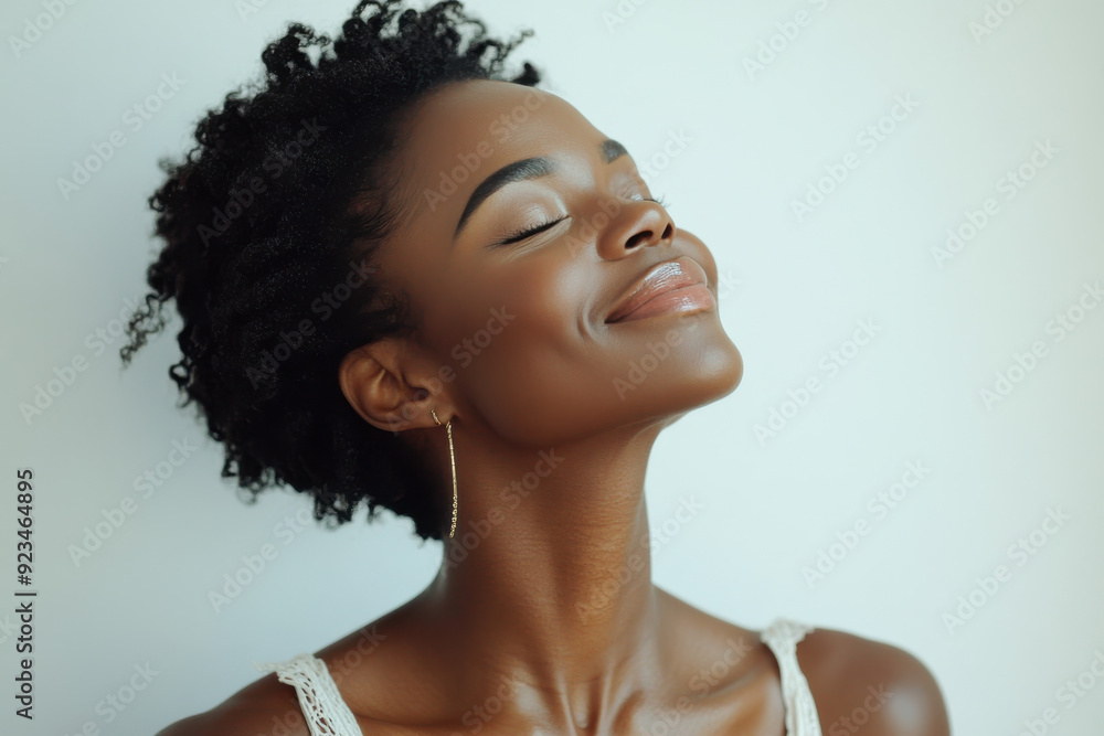 A close up of a black woman's face with her eyes closed A close up of a black woman's face with her eyes closed