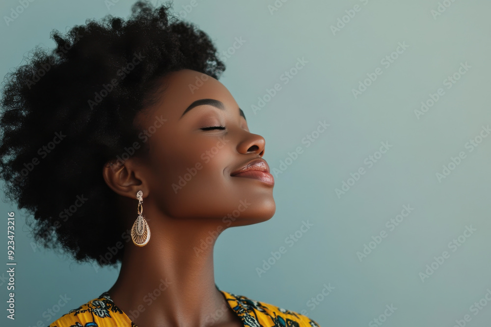 A close up of a black woman's face with her eyes closed A close up of a black woman's face with her eyes closed