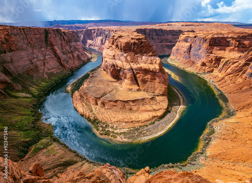 Horseshoe Bend is a U-shaped incised meander of Colorado River near Page, Arizona, USA and part of Grand Canyon. Panoramic wide angle view of river loop and colorful red sandstone. Major attraction.