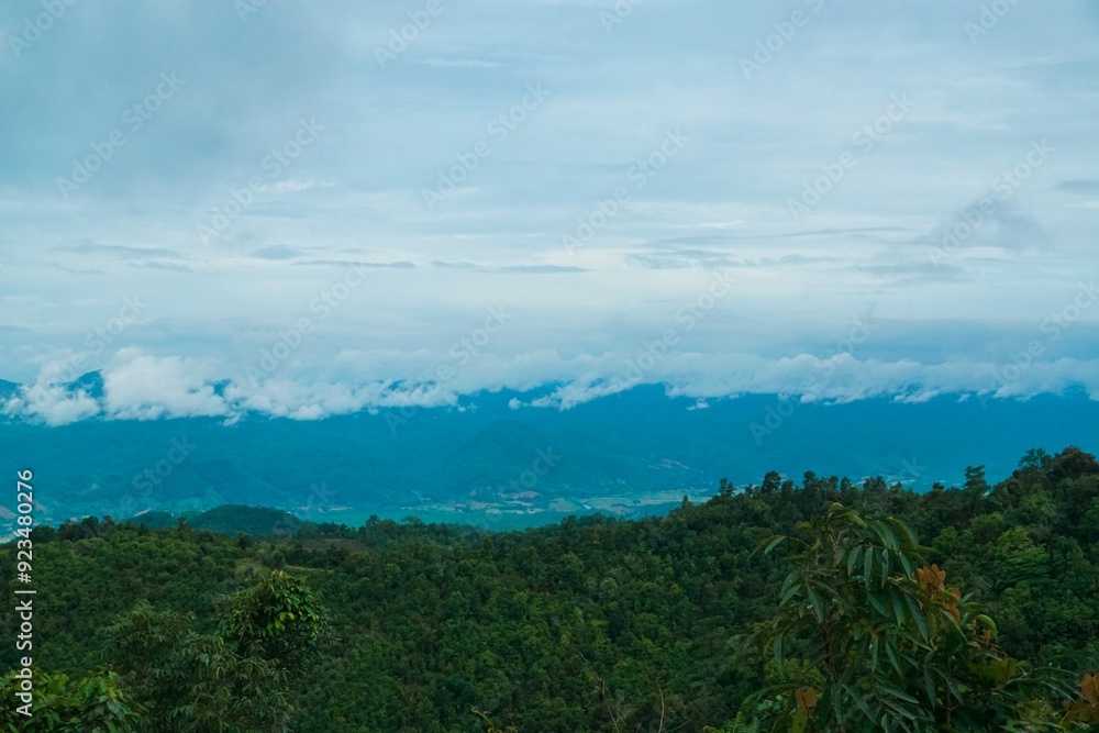 The sky is cloudy and the mountains are in the background The sky is cloudy and the mountains are in the background