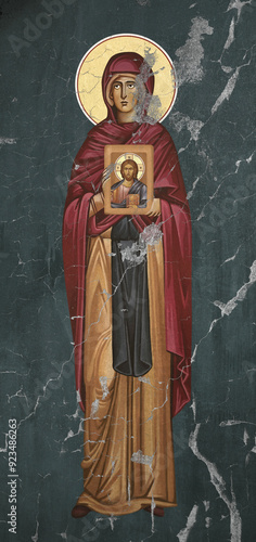 Traditional Christian icon of Sv. Petka. Saint Parascheva of the Balkans. Antique illustration on cracked wall in Byzantine style photo