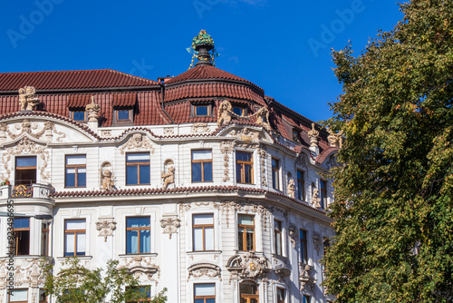 Old white building with red roof in Prague, Prague architecture on an autumn day