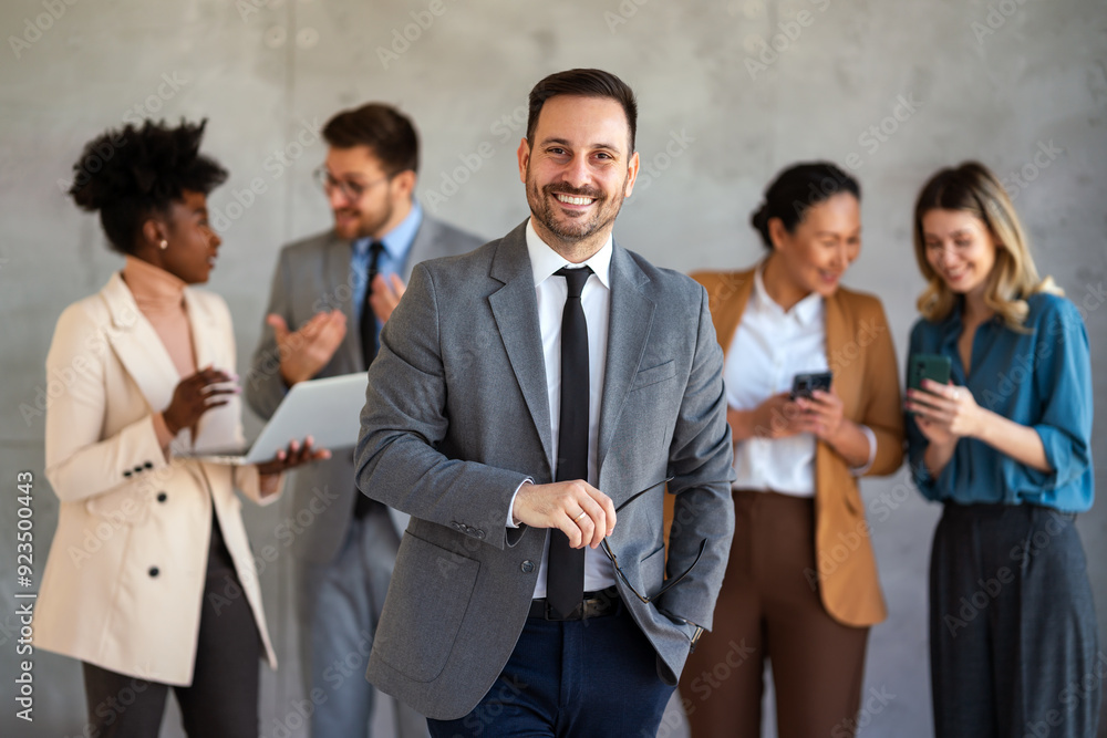 Portrait of multiethnic group of diverse corporate colleagues standing in a row at modern office Portrait of multiethnic group of diverse corporate colleagues standing in a row at modern office