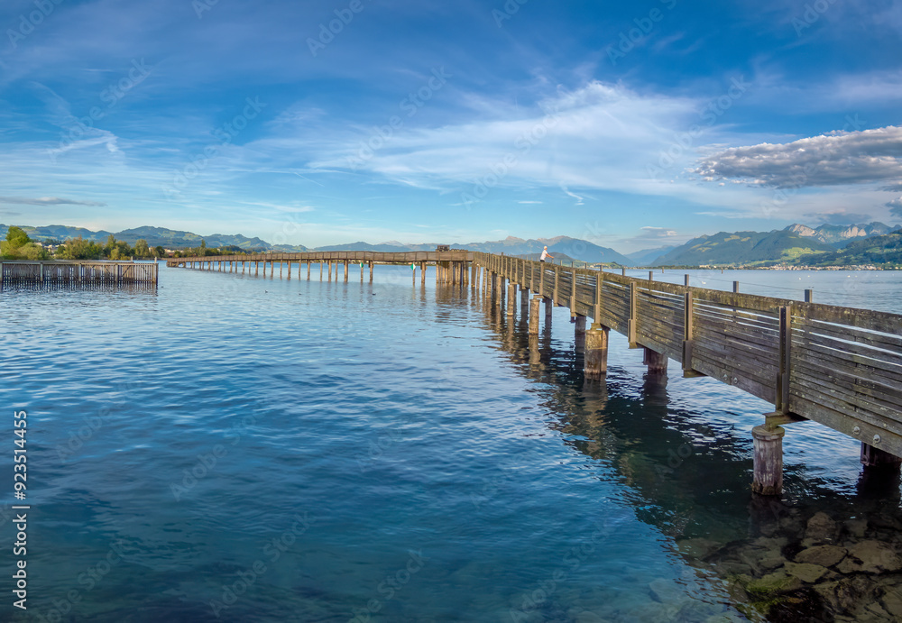 Line fishing on the historical wooden bridge near Rapperswil, Upper Zürich Lake, St. Gallen, Switzerland Line fishing on the historical wooden bridge near Rapperswil, Upper Zürich Lake, St. Gallen, Switzerland