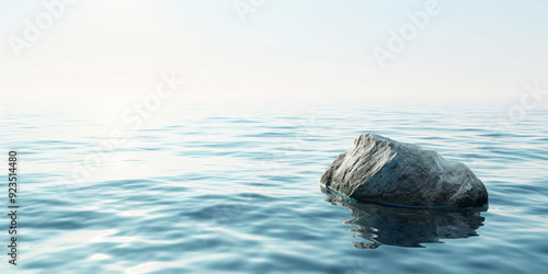 Serene Ocean Scene with Lone Rock and Gentle Waves at Sunrise